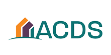 Logo with three stylized house shapes in orange, white, and purple next to the green letters 